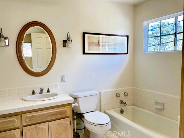 MASTER BATHROOM WITH DOUBLE SINKS, TUB AND SEPARATE SHOWER AND A MAKEUP AREA.