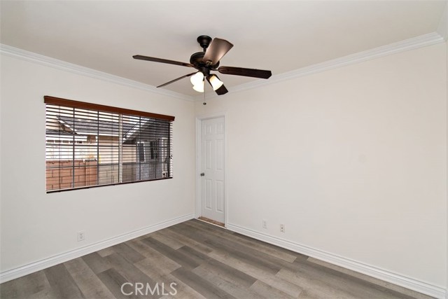 Bedroom 3 with ceiling fan and access to garage