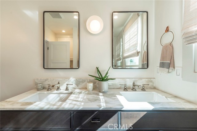 Double sinks with marble counter top