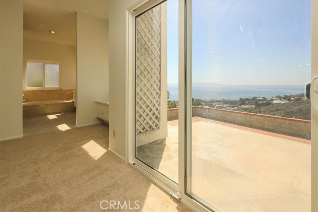 Sliding glass doors provide access to the patio from the master suite.