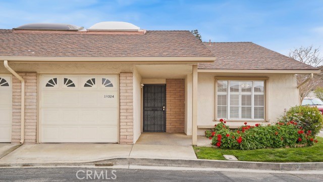 Welcome to Friendly Valley a 55 + gated community with lush green landscaping and resort-style living at its finest!  This 2-bedroom 2 bathroom condo sits on a corner lot and spans 1,666 square feet with new flooring and a new water heater. The spacious floor plan offers an inviting living area and enclosed patio/back room and atrium.  
The Friendly Valley HOA amenities are generous and includes basic cable, internet, weekly refuse collection, and exterior upkeep (including paint and landscaping).  Recreational amenities include a clubhouse, pool and private golf course.  The security gate is monitored by a 24 hour guard.  This home has it all!!! Located near shopping, dining, and entertainment.