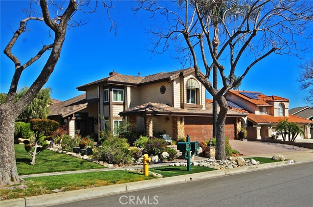 1852 Eastgate Avenue Upland, California Fabulously appointed beyond your wildest dreams with almost $400,000 in wonderful features & quality upgrades! You may never want to leave this stunning Upland home that is designed for stylish entertainment indoors & out. Enjoy the private putting green, koi pond with waterfall, gas Tikki torches, custom stream, resort-inspired BBQ, 3 outdoor flat screens, surround sound system & custom fire table with red fire glass. Magnificent entryway features double doors with sidelites and transom window. Soaring 2-story ceiling over the open formal living room & separate formal dining room. More items include a hand-forged wrought iron staircase railing, hickory wood floor, travertine tile floor, Mexican onyx sink/wall inset, custom stained glass accents, newer dual pane windows, rebuilt patio cover & canopies, newer roof, rebuilt cedar-lined closets & security system. Gorgeous chef's kitchen offers a 6-burner range & long granite breakfast bar overlooking the patio, putting green & bridge. The kitchen opens to a spacious family room with a fireplace & bar. Double stained glass doors open to a large master suite with a luxurious bathroom, dual sinks, soaking tub, separate shower & walk-in closet. Gated RV parking, mountain view, copper garage doors/rain gutters & elegantly finished garage with ample storage. If you really want to spoil yourself, take a close look at this jaw-dropping home & grounds! It is truly one of most lavishly upgraded properties you will see!
