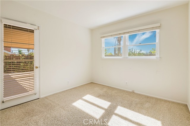 Bedroom 4 has a door leading to the backyard.  Nice for an office or craft room.