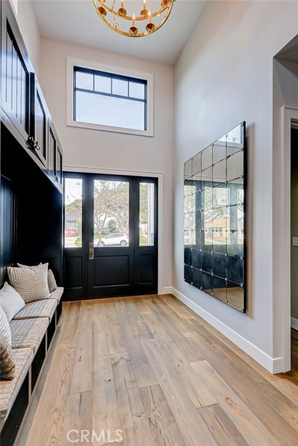 Foyer with Restoration Mirror and Coat/Hat Rack Storage Bench from Hallway