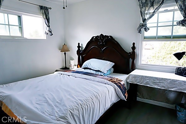 one of the bedroom with two windows