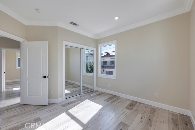 Second secondary bedroom has mirrored closet doors.