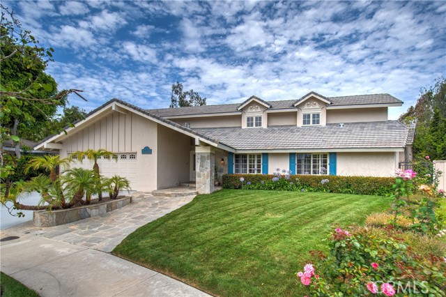 1601 Port Barmouth Place Newport Beach, California This Italianate California villa sits on one of the largest lots of all the Harbor View Homes. It has been extensively and beautifully remodeled by Tony Massaro, the architect of the Mariners Church (Chapel). This 6 bedroom, 4 bathroom home contains a private addition, which could be used for relatives or guests. Most of the home is on the first floor, including the master bedroom suite and the addition. There are plantation shutters throughout, a new 2017 roof, two new 2017 air conditioners, two new furnaces, a new water heater (2021), and another new 2017 tankless water heater. There is a whole house music system, an alarm system, a fireproof floor safe, and a 24’ X 5’ walk-in closet in the master bedroom. The property is beautifully landscaped with Belgard pavers, winding paths, and numerous lemon, orange, lime, grapefruit, fig, pomegranate, Jacaranda, and persimmon trees. The garden contains numerous and varied species of flowers, plants, and roses. Two of the four full bathrooms have Japanese Toto toilets and large cast iron tubs. The master bedroom contains a gas fireplace faced in imported Portuguese tiles. Every room has built-ins for books and displays. The house faces East West and is bright, inviting, and cheerful.
