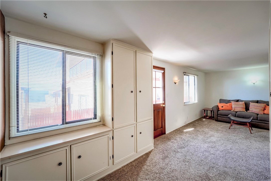 The lower level fourth bedroom suite has lots of storage cabinets and a closet.  The separate outside entry door is to the left..
