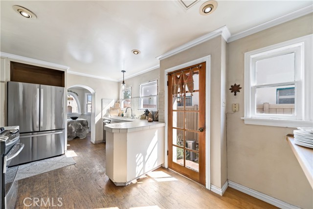 Kitchen door leads to the side yard.