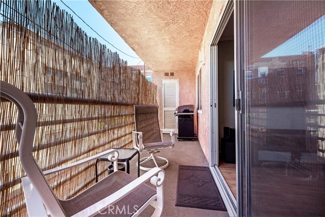 Patio/balcony is a great place to unwind.  The louvered door has room for storage and contains the hot water heater.