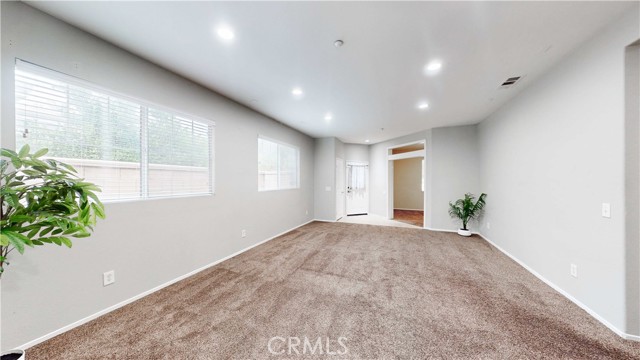 Spacious Living room.  Note office with double doors near entrance