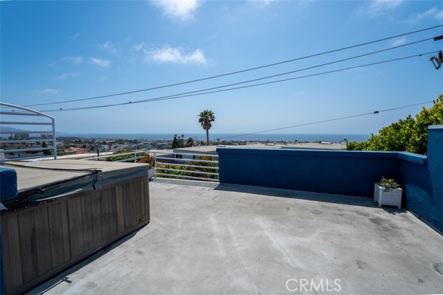 Unit 1 rooftop deck with hot tub - facing south.