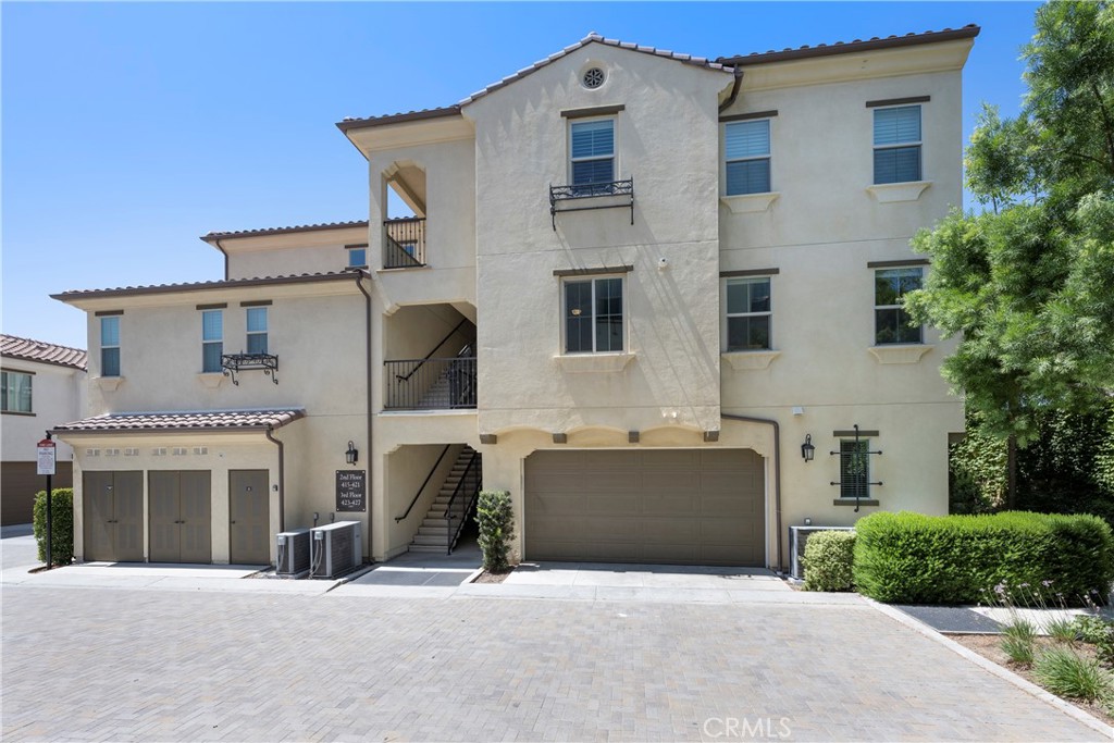 The 2 Car Garage has Direct access to the home and there are stairs leading to the Main Level Entry or to the right you have the Private Entrance to the Downstairs Work/Life space!
