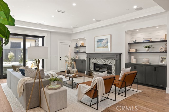 Family Room with Built-in Cabinetry and Statement Fireplace