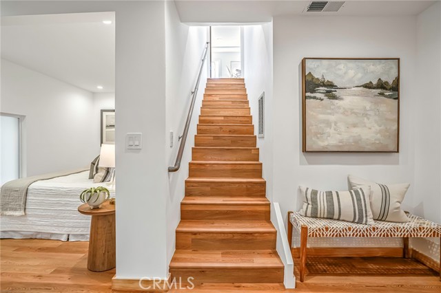 Stairs lead upstairs to the street side living room.