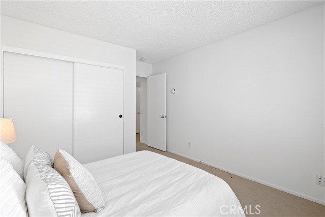 The second bedroom with large closet space also feature built-in bookcases.