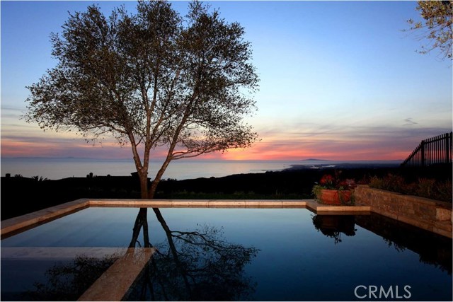 21 Shell Beach Newport Coast, California Located on Crystal Cove’s coveted Shell Beach panoramic ocean view street within the communities Custom homesite enclave this estate leaves nothing to be desired. The Mediterranean inspired estate boasts 7 bedroom suites, 10 bathrooms and just over 9,000 sqft of living space on an ocean view 17,500 sqft lot. Authenticity and quality abounds through the property which offers private pool and spa, large theater with custom sound system, wine tasting room with bountiful storage, double kitchen and laundry rooms. The gorgeous architecture features top of the line details throughout, including an extensive use of stone and hardwood flooring. Large master, guest suite and petite master comprise of three of the seven bedrooms. Once outside you are captivated by endless views of Newport harbor up the California Riviera to Palos Verdes, the pacific ocean with Catalina resting in the backdrop and year round sunsets.