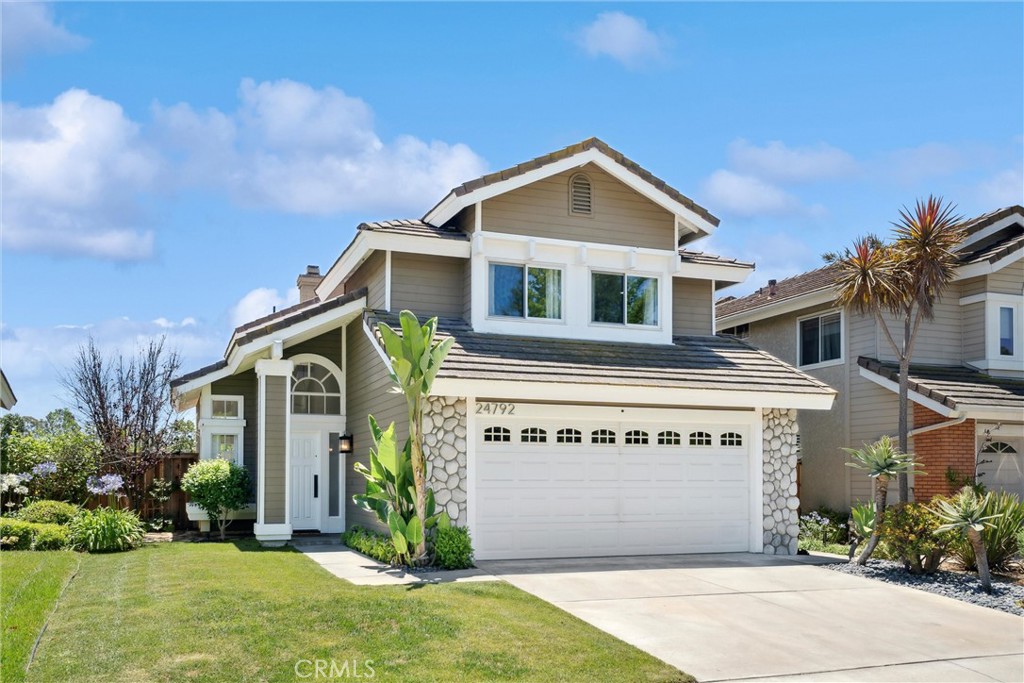 Beautiful 3 bedroom, 2.5 bath view home move in ready! This home is light and bright with lots of windows and dramatic vaulted ceilings. The  living room is open to the formal dining room and great for entertaining. The kitchen is remodeled  white cabinets, granite counter tops and a large island with stylish pendant lighting and seating for dining. The family room is open to the kitchen and has a cozy fireplace.  The primary bedroom has a beautiful view and features a retreat with a fireplace. The primary bathroom features a double vanity, tub and walk in shower. There are two additional bedrooms and an additional bathroom located upstairs. Additional features of the home include newer windows, new carpet and the interior of the home downstairs has been freshly painted. The backyard has treetop views with a spacious patio as well as a grassy area. Fantastic location close to parks, schools and restaurants.