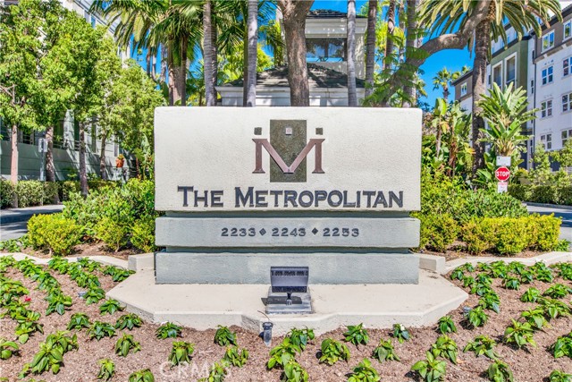 The Metropolitan complex is the hidden gem of Irvine. Surrounded by lush landscaping, this guard gated community has resort style living. This 2 bedroom, 2 bath condo has over 1200 square feet and an open floor plan. It has 9 foot ceilings in bedrooms, Dining room and Living room. The kitchen has a Stainless Steel Dishwasher, Stove and Microwave. Quartz counters with glass tile backsplash and a nice breakfast bar, A Stainless Steel double sink and plenty of cabinets and recessed lights.There is also a stacked Washer and Dryer in the kitchen. The Living room has plenty of light with access to the balcony and open to the dining room with a fan. The Primary Bedroom has a Walk-in closet and access to the balcony. The Primary bathroom has a separate shower and tub, double sinks. The Guest bedroom has a walk-in closet. The Guest bathroom has a Tub/Shower combo. There is a room as you enter that could be a Formal Dining Room or Office. There is carpet in the bedrooms, Beautiful wood laminate flooring throughout the rest of the condo. The complex has a beautiful Pool, Spa and Gym. There is also a Clubhouse that can be rented out. 2 parking spots and plenty of guest parking. Lushly landscaped walking path around the complex. Single level unit on the sen=cond floor. Minutes to Santa Ana Airport, Restaurants, 73, 405 and 55 Frwys, and a short drive to shopping and the Beach. HOA fee includes water, trash and sewer. Professional interior pics coming soon. You don't want to miss this one!!!!