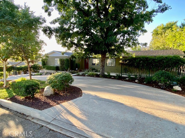 36126 Panorama Drive Yucaipa, California WOW look at this impeccable remodeled home nestled in upper Yucaipa located on cul de sac. This 3 bedroom 2 bath home is gorgeous, walk into large open floor plan, new upgraded waterproof Vinyl flooring throughout, custom paint, large living room with limestone fireplace, kitchen is a cooks dream with stainless steel kitchenaid appliances, 36" professional stainless steel stove, Custom Flush vent in ceiling, built in oven/microwave combo, Custom design white cabinetry extra deep, over abundance of storage oversized drawers, built in mixer lift, large SS single sink. Large private Master bedroom with 2 large spare bedrooms on opposite of the house, walk in closet with organizer. Indoor laundry with stackable washer/dryer. Walk outside to private back patio to enjoy take in the view of the mountains, mature walnut trees, flowers everywhere you look so relaxing and peaceful. Added bonus is the RV parking, oversized 2 car garage with 2 car carport, lots of extra parking for all the toys. Circular driveway up front for even more parking. Easy maintance front yard. This home is a must see.