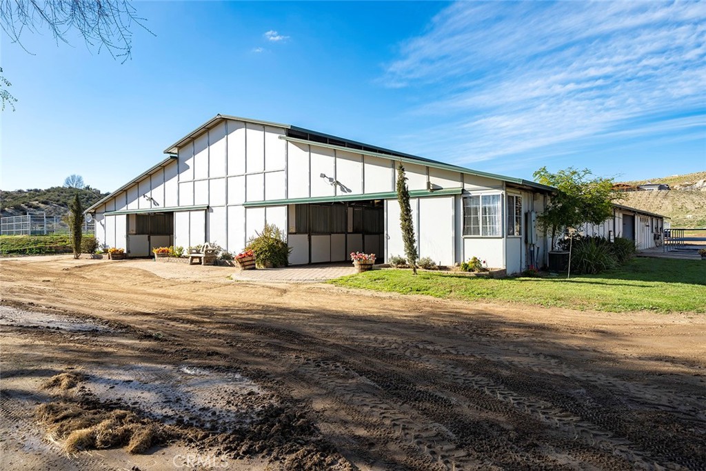 40270 Green Meadow Road Temecula, California EQUESTRIAN FACILITY WITH INCOME! TURNKEY 39.77 acre facility with EVERYTHING you need for your own boarding stable or training facility. Global Sporthorse Stables currently hosts a variety of successful horse shows including Hunter/Jumper, Dressage as well as clinics of all different disciplines. With its quaint charm and covered decks overlooking the beautiful gardens and grounds, the fully furnished home is also a money maker as an Air BnB, or a great place for Retreats! Your fully equipped facility includes; 29 stall BarnMaster Barn w/office,restroom,lounge, tackroom, tack up/wash areas (40 stall size). In addition there is a 6 stall barn w/16x18' stalls/2 tack rooms*7 stall shedrow stallion barn*12 stall In n Out Mare Motel*90x210 COVERED/LIGHTED riding arena with premium footing and new Dressage Court*150x300 outdoor arena with Prem. footing, Ringside Gazebo & Jumps*180X150 practice/show jumping arena*70ft~6 horse Eurosizer w/sprinklers & premium footing*60ft Centaur Round Pen w/footing & Sprinklers*1000 bale hay barn*Tractor barn*2 RV parking spots W/hookups plus abundant dry camp spots*Large-Open Pasture area suitable for Cross Country Course*Ample Horse trailer parking and miles of riding trails right out your gate*You also have over 20 large pastures to choose from! Property has the perfect house pad waiting for you to build (on a hill overlooking the whole property with 360 degree views). On the fringe of Wine Country! PLEASE SEE SUPPLEMENTS FOR ADDITIONAL FEATURES