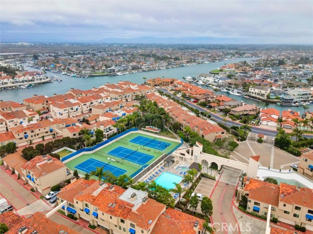 Aerial shot of pool and tennis courts included in HOA.