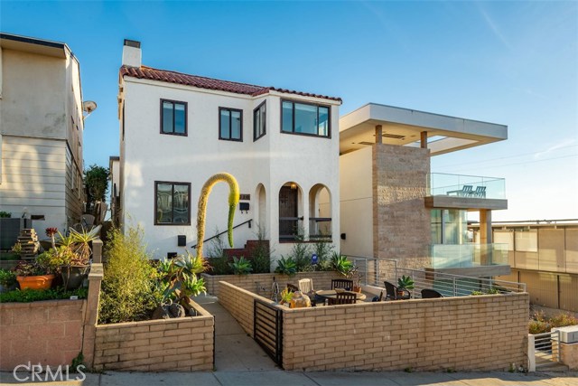 220 13th Street Manhattan Beach, California RARE opportunity to own TWO OCEAN VIEW HOMES ON A WALK STREET in downtown Manhattan Beach ONLY A BLOCK FROM THE BEACH! Updated 4 bed/3 bath 1920s Spanish on the walk street side & more recently remodeled 3 bed/3 bath South-Facing Mid-Century Modern on the alley side…both with 2-car tandem garages that offer an easy direct approach through the city parking lot. Perfect for the Buyer who wants to live in one & rent the other…or the buyer with extended family…or the buyer who needs a vacation home compound with privacy!!! Leave your car in the garage because this property is a SHORT WALK TO EVERYTHING! CURRENTLY VACANT FOR TOTAL FLEXIBILITY! Pro forma rents are $15k total ($9k Front House & $6k Back House).