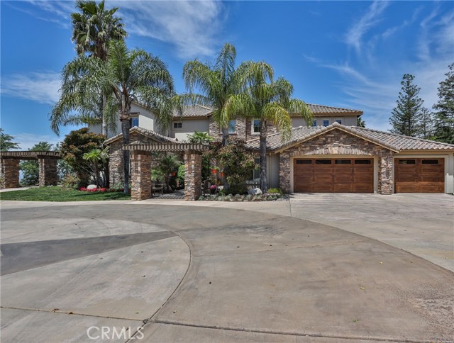 36475 County Line Road Yucaipa, California This family compound must be toured to fully appreciate all of its quality, amenities, endless views and peaceful privacy. As you enter the main house you will be impressed with the soaring ceiling and two-story wall of windows in the living room with formal dining room. A great room features a gourmet kitchen, casual dining and relaxation area with exits to the fully equipped outdoor kitchen and pool/ spa with fire pit. A large crafts room is between the kitchen and utility/ laundry room. This main home features 6 bedrooms with 5 ½ baths in approximately 6,119 square feet of living space. The master suite and guest suite are located on the first floor. There is a guest house which includes a large great room with a full bar, fully equipped kitchen, 1 bedroom and 1 ½ bath within approximately 1,450 square feet of living space. The main house has an attached 3-car garage. There is an additional oversized detached garage which will park 6 cars or suitable for RV storage.