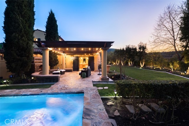 22 Golden Eagle Irvine, California Experience the exclusive lifestyle of Orange County's elite in the prestigious guard gated community of Shady Canyon! This custom European-influenced 6 bedroom almost 7000SF estate is ideally situated at the end of a private cul de sac nestled back on an expansive 26,920 Sf lot. Upon entry to the main floor is formal living room, private office, large ensuite guest bedroom, temperature controlled 3 zone wine cellar, spacious gourmet kitchen open to family room. Formal Dining room to seat 12. Oversized walk-in pantry, Viking appliances, steam, bake ovens & range. Instant hot water & water softener system. State of art security system. Commercial grade home network system & telecommunications internet WiFi system."Hollywood" inspired panic room for extra security. Custom locks & door handles. Richard Marshall hard wood flooring, Aluminum metal frame structure & wall panel under Venetian plaster & stucco walls. Rare Main floor master suite w/ master closet & luxurious master bath. 2 additional ensuite bedrooms right next to master downstairs. ideal floor plan for close proximity of bedrooms. downstairs laundry. 2 additional upstairs ensuite bedrooms & spacious loft. 4 car garage. Expansive outdoor resort grounds w/pool, spa, manicured lawn & fountain. Shady Canyon offers world class Tom Fazio golf course, clubhouse, tennis courts & Country Club all bordered by nature preserve w/ hiking trails all the way to the Pacific ocean. Close proximity to many top schools, shopping & beach