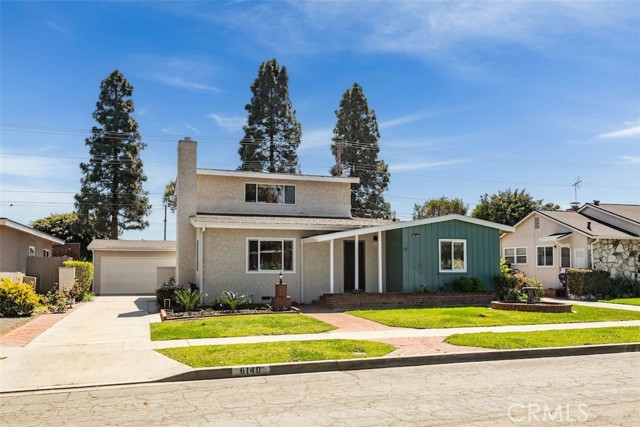 Mid-century modern gem with long driveway that has space for a gated entry, RV potential,grassy front yard, and an excellent mid-block location.