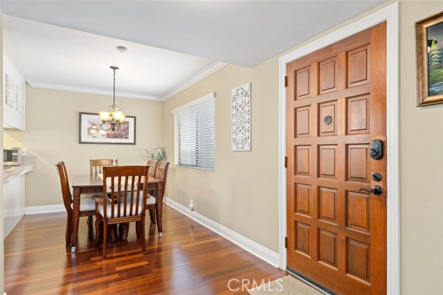 Formal dining-room, attached kitchen, warm colored paint and welcoming front door entry