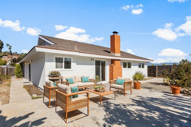 Virtually staged back yard. The back yard faces west so great sunset skies! Large side yard with slope for lots of fruit trees!