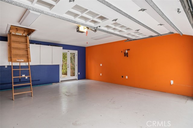 finished garage with stand up attic and french doors to pool