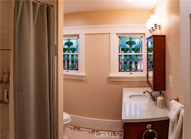 Downstairs remodeled full hall bath.