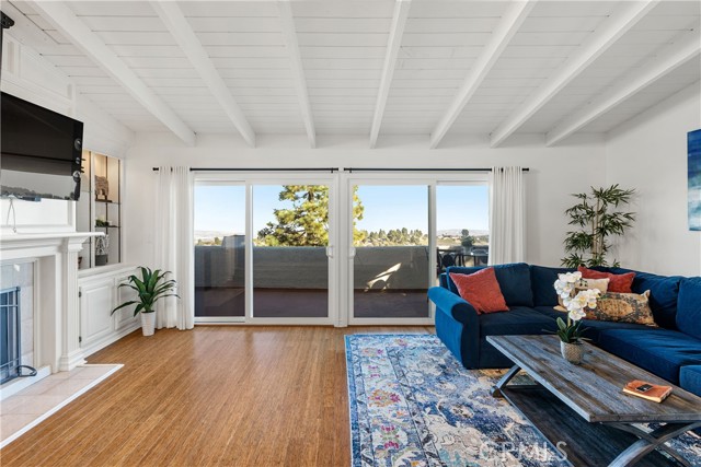 Vaulted, beamed ceiling is enhanced by contrasting bamboo flooring.