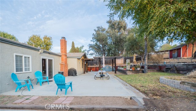  VIEW OF BACKYARD PATIO AREA FROM ROAD TO THE BACK