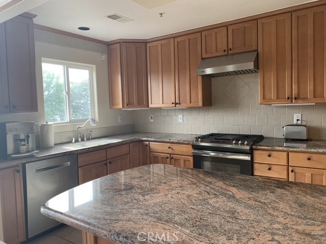 West facing Kitchen featuring granite countertops