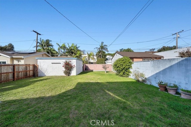 Large back yard with detached garage off the alley