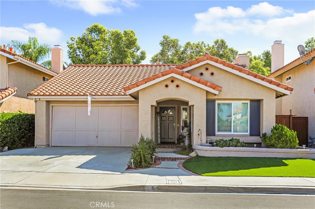 Have you been dreaming of that highly coveted indoor/outdoor California lifestyle? This is the home for you! 8 Ojai Ct. is a SINGLE LEVEL home in the heart of Rancho Santa Margarita. Soaring vaulted ceilings in the main living space welcome you in. The family room features an updated fireplace and plenty of natural light from the tall windows. A perfect neutral palette boasting luxury vinyl floors and tall baseboards, dual pane windows, neutral paint, it is truly move in ready. The kitchen has been upgraded with granite counter tops, stainless sink and appliances and a large slider that opens onto the back patio space. The master bedroom has more of those lovely vaulted ceilings and a slider to the patio. The attached bathroom has been updated with new counter tops and shower enclosure. The secondary bedroom is spacious and steps away from the full hallway bathroom, also updated with new counter tops and sink. The backyard space is a true private oasis. The covered section provides plenty of shade for those warm summer days with ample uncovered space to enjoy! Excellent curb appeal with newly installed drought resistant turf. Desirable location near RSM lake, award winning schools, shopping and dining and toll roads, this home immaculately maintained and boasts true pride of ownership. A must see!