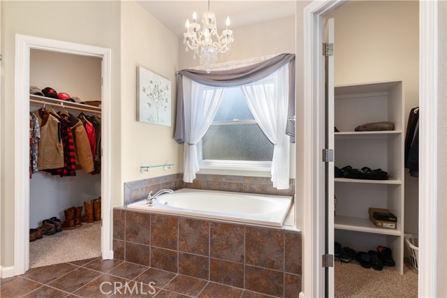 Master bath with dual walk-in closets