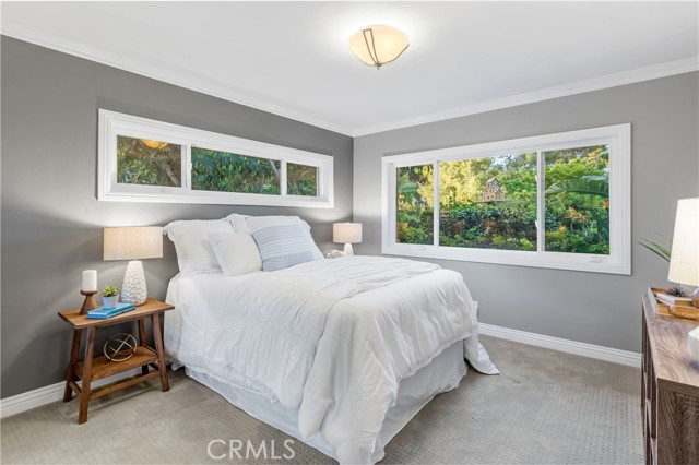 Bedroom 2 - Adorned with crown moldings and baseboards, and offer spacious closet space.