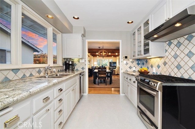 Beautiful kitchen with newly painted cabinets and granite countertops.