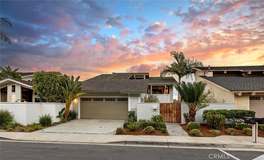 Perched within the prestigious, gated community of Laguna Woods, 17 Morning Wood Drive is a stunning mid-century gem designed by renowned architect Chris Abel. This home sits on a single-loaded street with only 88 residences, offering privacy and tranquility in an exclusive enclave. Abel’s signature design elements are present throughout this 3-bedroom Carmel (Model A) home, with vaulted ceilings that invite natural light and seamlessly blend indoor and outdoor living spaces.

At the heart of the home is the entertainer’s kitchen, outfitted with quartz countertops, high-end KitchenAid stainless steel appliances, a farmhouse sink, and a waterfall island centerpiece. Light modern engineered wood flooring flows effortlessly throughout, complementing the open-concept design. The main level showcases a sophisticated living room with a marble fireplace, a bedroom with an ensuite bath and private patio, and a dining room that overlooks lush foliage. An adjacent deck provides a serene space to take in the natural surroundings.

Downstairs, the master suite serves as a private retreat with its own fireplace and direct access to the backyard, complete with an in-ground spa for ultimate relaxation. The master bathroom has been thoughtfully upgraded with quartz counters, sleek cabinetry, and modern fixtures. An additional bedroom, bath, and convenient laundry area complete this level.

This meticulously maintained home boasts numerous upgrades, including PEX re-piping, a solar system with an LG Powerwall, a security system, newer HVAC and furnace, and fresh exterior paint with a custom wood slat gate. The attached garage features epoxy flooring and ample storage, enhancing the home's functionality. The gated community provides access to a pool, spa, BBQ, and picnic areas, perfect for enjoying the quintessential California lifestyle.

Located just minutes from world-class amenities such as the Ritz Carlton, Waldorf Astoria Monarch Beach Resort, Salt Creek Beach, and upscale shopping and dining, this architectural masterpiece is an unparalleled opportunity to elevate your lifestyle.