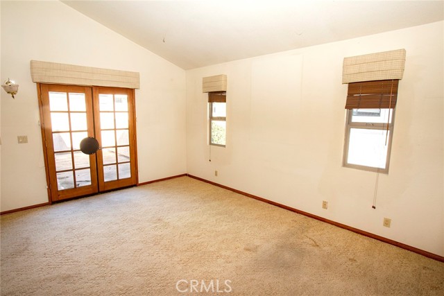 Master Suite: Vaulted ceiling, French Doors to Balcony