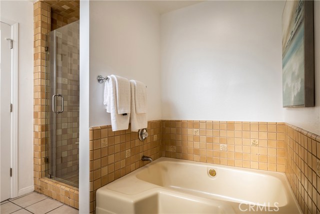 New shower enclosures and additional  tub in master