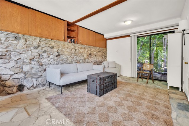storage area with 3/4 bath behind garage on lower level\n