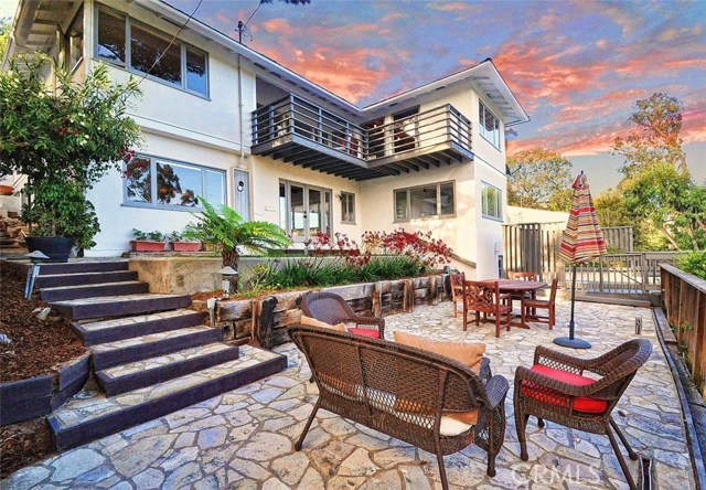 Spectacular terraced back yard with fabulous outdoor living, lap pool, and spa.