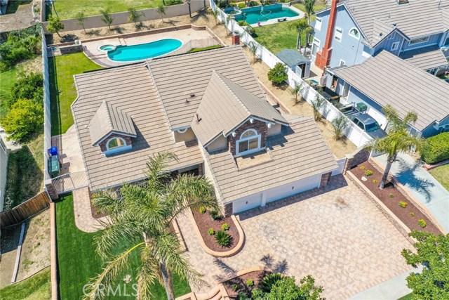 6574 Flagstone Place Rancho Cucamonga, California Searching for space to move around both inside and out? This expansive home has been completely remodeled and showcases grand, elegant and luxurious features from top to bottom. Towering ceilings, oversized windows and an open layout ensure this home will feel generous and inviting from the moment you step inside. There are multiple living spaces on offer, including a formal dining and living room. The spacious open kitchen overlooks the breakfast area and family room featuring a fireplace and a wet bar. Contemporary in its design, the kitchen is well-equipped with plenty of countertop space and storage, plus you can step outside and cook up a feast on the built-in barbeque. Ready and waiting for the avid entertainer, this outdoor area is huge and offers a large covered patio with gorgeous views over your swimming pool with spa and fully fenced backyard. The long list of must-have features includes a paid-off solar system that offers 30 panels , landscaped gardens, a three-car garage, large bedrooms, ceiling fans, and a beautifully-finished master bath. Come see it all before it's gone for good!