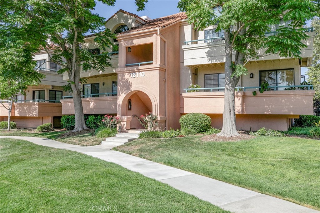 Welcome to 18110 Erik Ct Unit 593, a. warm and inviting end-unit condo nestled in the Canyon Park Village. This inviting condo has a sunlit open-concept layout with rich hardwood floors, plantation shutters and a cozy fireplace elegantly surrounded by tiles. Whip up your favorite meals in the kitchen which features granite countertops, tiled backsplash, a breakfast bar and tiled floors! The condo features two generously sized bedrooms, including a master suite with an ensuite bathroom and walk-in closet. This unit also comes with a stackable washer and dryer included! There is a 2 car garage which offers ample storage space for your convenience and a brand new EV charger for your electric car needs! Property also recently has been installed with a brand new water tank. HOA covers water and trash. Ready to make it yours? Call me today for a private showing or for open house schedules!