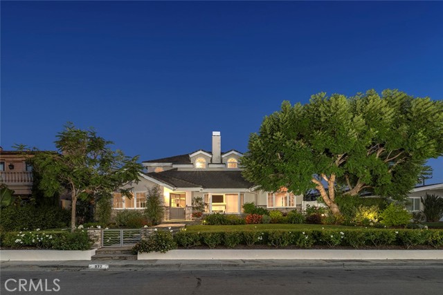 A charming and inviting ocean view home in coveted Newport Heights with mature landscaping on a gentle sloping front yard.